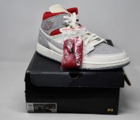 A pair of as new Nike Air Jordan 1 Mid Prem (UK 14).