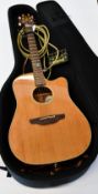 A pre-owned Takamine - Santa Fe ESF 10C electro-acoustic guitar with gig bag and accessories (Some