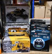Three Flysky RC model technology FS-16 controllers and five assorted remote control toys.