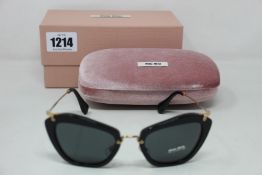 A pair of as new Miu Miu sunglasses.