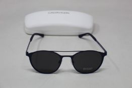 A pair of as new Calvin Klein sunglasses.