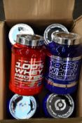 Six 920g tubs of Scitec Nutrition 100% whey protein in white chocolate, chocolate and strawberry &