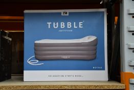 A boxed as new Tubble Royale inflatable bathtub.