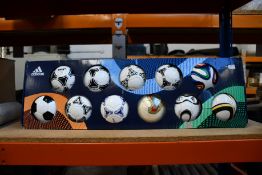 An Adidas historical mini football set (Some damage to box).