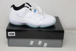 A pair of as new Nike Air Jordan 11 Retro Low (UK 7).