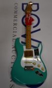 An as new Fender Vintera series 50's Stratocaster in Sea Foam Green with a Fender Guitar bag.