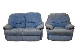 A blue two seater sofa together with an armchair.