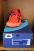 A pair of as new Asics High Jump Pro trainers (UK 6).
