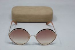 A pair of as new Chloe sunglasses.
