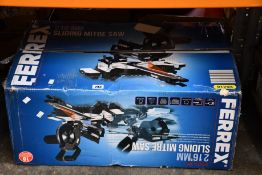 A Ferrex 2000w 216mm sliding mitre saw.