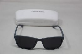 A pair of as new Calvin Klein sunglasses.