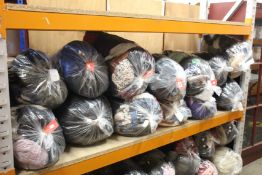 Thirteen bags of pre-owned clothing and related items.