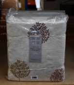 Two pairs of John Lewis & Partners Pencil Pleat Curtains with a mini olive tree design (RRP: £100).