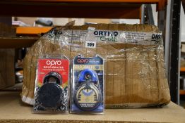 A quantity of Opro Gold Braces self-fit mouthguards and a quantity of retainer cases in an