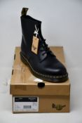 A pair of as new Dr Martens 1460 boots (UK 11).