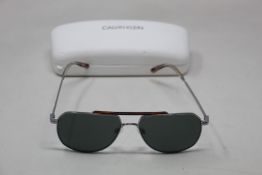 A pair of as new Calvin Klein sunglasses.