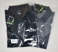 Two as new Hugo Boss polo shirts (M, XXXL).