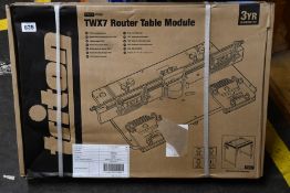 A boxed as new Triton TWX7 router table module.