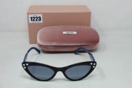 A pair of as new Miu Miu sunglasses.
