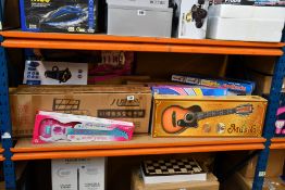 A quantity of children's assorted musical instruments to include keyboards, guitars, speaker and