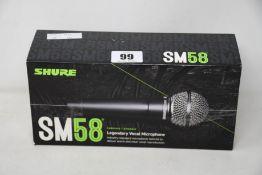 An as new Shure SM58 legendary vocal microphone.