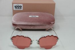 A pair of as new Miu Miu sunglasses.