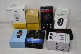 Eight assorted unbranded smart watches and two pairs of unbranded earbuds.