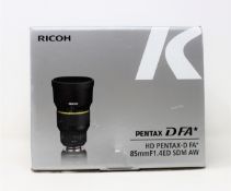 A boxed as new Ricoh Pentax HD D FA* 85mm F/1.4 ED SDM AW Lens (Box sealed, some damage to box).