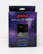 A boxed as new Pentax O-GPS1 Wireless GPS Unit (39012) (Some damage to box).