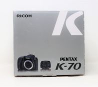 A boxed as new Rioch Pentax K-70 with 18-50mm WR Lens Kit (Box sealed, damage to box).