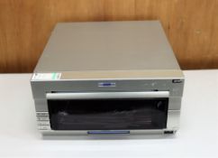 COLLECTION ONLY: A pre-owned DNP DS40 photo printer (Damage to front panel).