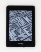 A pre-owned Amazon Kindle Paperwhite 4 (P/N: PQ94WIF) (Scratches to screen and casing).