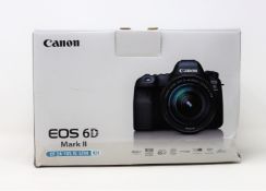 A boxed as new Canon EOS 6D Mark II and EF 24-105mm f/3.5-5.6 IS STM Lens Kit (Box opened, box
