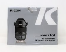 A boxed as new Rioch HD Pentax-D FA 24-70mm F2.8 ED SDM WR Lens (Box sealed, some damage to box).