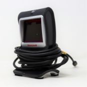 A pre-owned Honeywell Genesis 7580G-2 1D 2D USB Presentation Barcode Scanner.