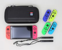 A pre-owned Nintendo Switch (HAC-001-01) 32GB with 128GB SanDisk Micro SD card, Lego Jurassic