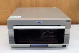 COLLECTION ONLY: A pre-owned DNP DS40 photo printer (Some cosmetic damage).