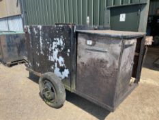 Metal tank on single axle chassis