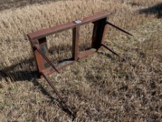 Bale spike with pin and cone brackets