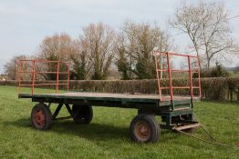 Four wheeled flat hay trailer, age unknown. Deck 16'6