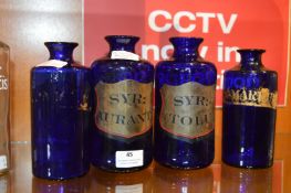 Four Blue Victorian Apothecary Bottles