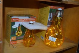 Two LED Light Bulb Ornaments