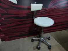 * cream gas lift stool with adjustable back on castors. Seat height 450 - 570