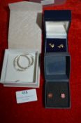 Two Pairs of Gold Ear Studs and a Pair of Sterling