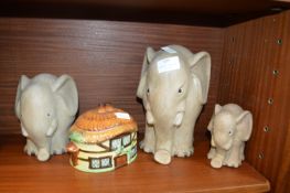 Three Pottery Elephants and a Cottage
