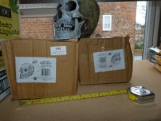 *Three Lifelike Human Skulls