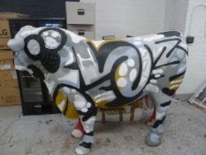* large statement piece - life sized fiber glass cow - with grafiti. From high end steak house.