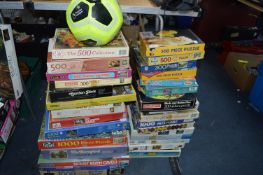 ~30 Jigsaw Puzzles, and a Football