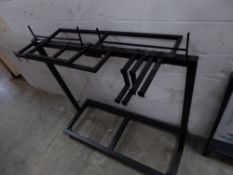 * black metal hanging rail on castors with 7 removable rails to suit various set-ups. 1500w x 600d x