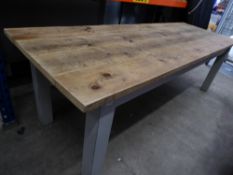 * large wooden farm house table - very solid. With rugged top and painted grey legs. Would seat 10-